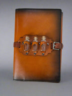 Leather RPG Journal - Tan and Black Potion Bottle Design - Front View - The Wyverns Workshop