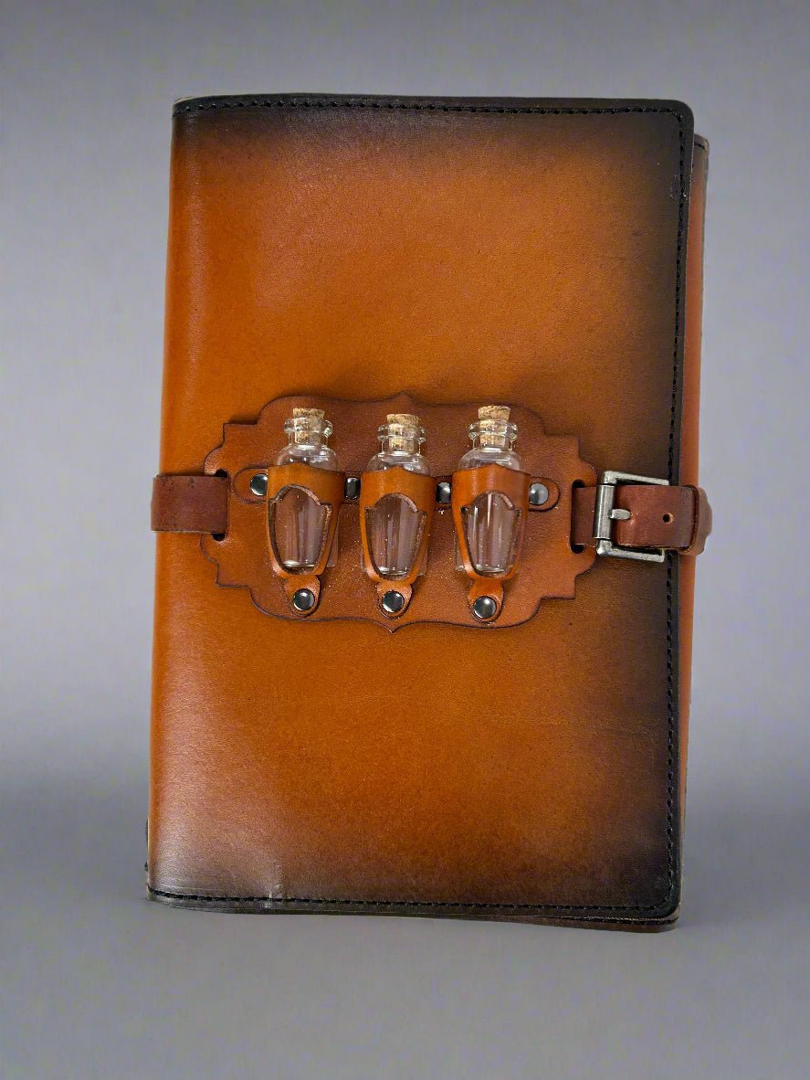Leather RPG Journal - Tan and Black Potion Bottle Design - Front View - The Wyverns Workshop